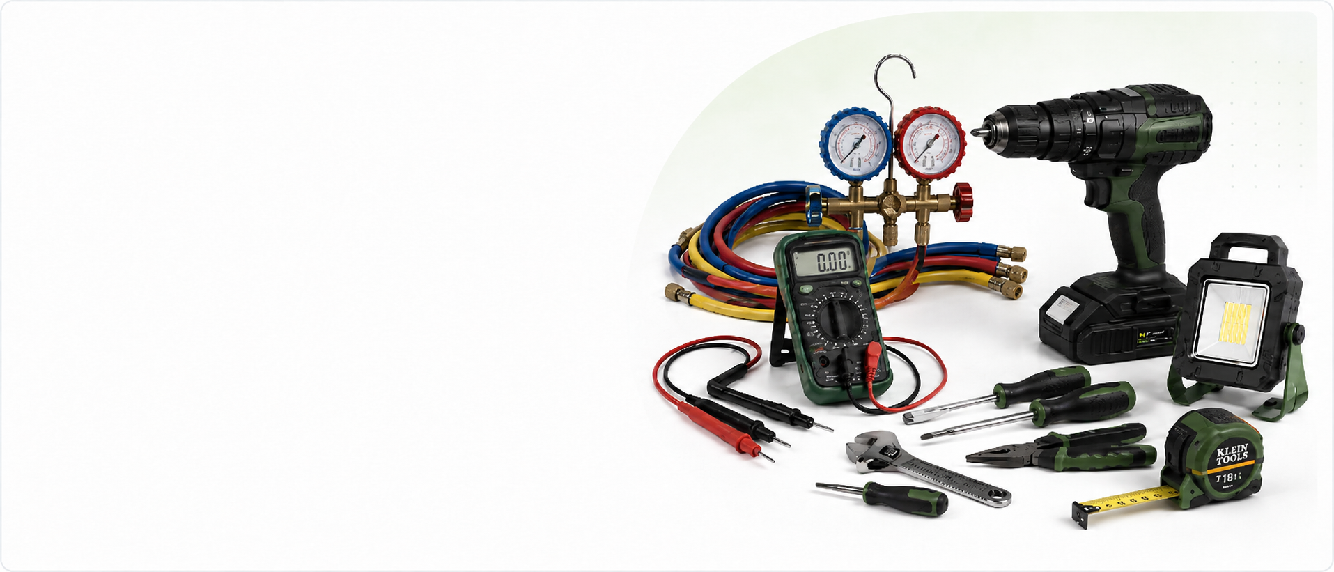 Maintenance tools including a drill, multimeter, HVAC gauges, hand tools, and work light